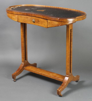 A 19th Century Continental walnut kidney shaped writing table with three-quarter gallery and inset writing surface, fitted 1 long drawer, raised on panel end supports 