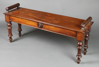 A 19th Century rectangular mahogany hall bench, raised on turned supports and with scroll arms to the side 19"h x 41 1/2"w x 12"d 