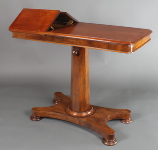 A William IV mahogany reading table, raised on a chamfered column, triform base, bun feet 28"h x 36"w x 17"d 