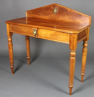 A Victorian rectangular mahogany side table with raised back, fitted a frieze drawer, raised on turned supports, the back and drawer and decorated the crest of Oxford University 37"h x 38 1/2"w x 18"d 