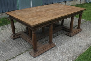A Victorian oak library table, raised on 12 turned doric columns and with geometric stretcher 31"h x 80"w x 49" 