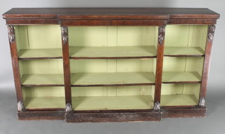 A Victorian rosewood breakfront bookcase with adjustable shelves and vitruvian scrolls to the side 40"h x 71 1/2"w x 14"d 