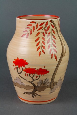 A Clarice Cliff polychrome tan glazed baluster vase decorated stylised trees 7 1/2" 
