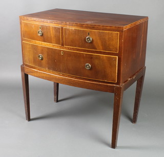 A 19th Century mahogany bow front chest of 2 short and 1 long drawer, raised on a later and associated base, the upper section with satinwood stringing and brass ring drop handles and escutcheons, raised on square tapering supports 31"h x 29 1/2"w x 18"d 