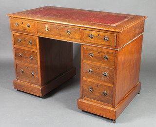 An Edwardian mahogany kneehole pedestal desk with inset writing surface above 1 long and 8 short drawers 28"h x 42"w x 23"d 