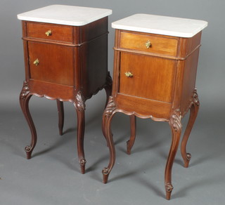 A pair of 19th Century French mahogany bedside cabinets with white veined marble tops fitted drawers, raised on carved cabriole supports 34"h x 16"w x 16"d