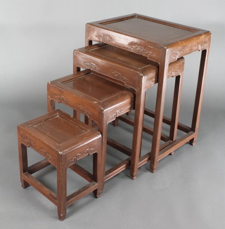 A nest of 4 Chinese Padouk wood interfitting coffee tables, largest - 26" x 19" x 15"d, smallest 13"h x 11 1/2"w x 8 1/2"d