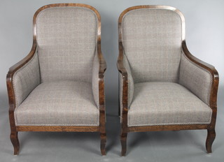 A pair of Biedermeier style show frame armchairs upholstered in cream material 