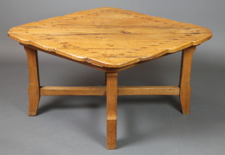 An oak Arts & Crafts diamond shaped occasional table with planked and studded top, raised on 4 chamfered supports with X framed stretcher 20"h x 43"w x 34 1/2"d