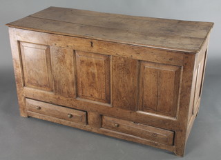 A 17th/18th Century oak mule chest of panelled construction with hinged lid, the interior fitted a candle box, the base fitted 2 drawers 27"h x 48"w x 21"d 