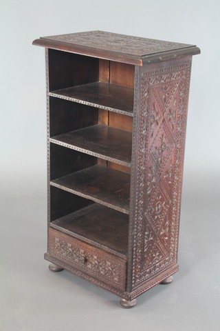 A 19th Century  Anglo Indian hardwood bookcase fitted 4 shelves with drawer to base, raised on bun feet, heavily carved throughout  35"h x 19"w x 12"d