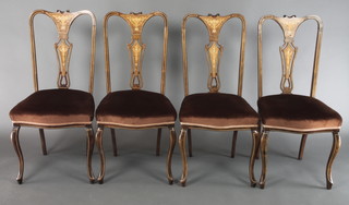 A set of 4 Edwardian inlaid mahogany splat back dining chairs, with upholstered seats, raised on cabriole supports
