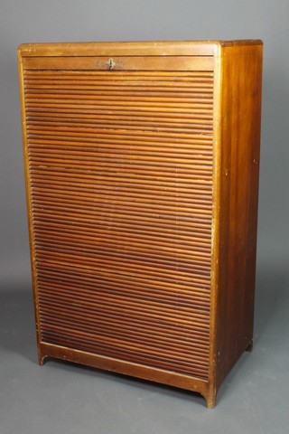 A 19th/20th Century mahogany office cabinet enclosed by a tambour shutter 48"h x 29"w x 18 1/2"d 