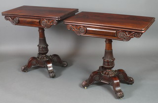 A pair of William IV mahogany tea/card tables, raised on turned column and scroll supports 29"h x 32"w x 16"d 