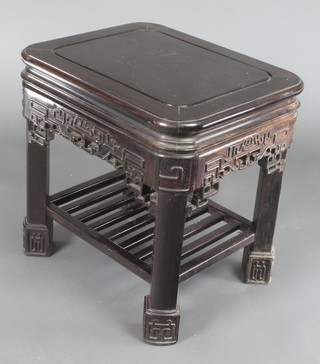 A rectangular carved Chinese hardwood occasional table with apron and undertier 22"h x 22"w x 18"d 
