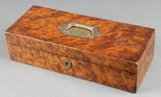 A Victorian rectangular amboyna trinket box with hinged lid and brass countersunk handle 3" x 12" x 5 1/2"