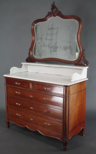 A French mahogany commode with shaped bevelled plate mirrored back above a marble top with three-quarter gallery, the base fitted 2 short and 3 long drawers, raised on cabriole supports 74"h x 45 1/2"w x 21 1/2"d 