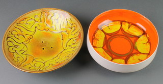 A Poole yellow ground flared bowl with free form decoration 57 11", a ditto orange bowl 89 8 1/2" 