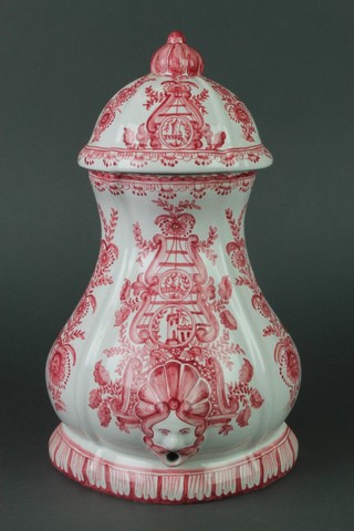 A Portuguese Delft style red glazed water pitcher with lid, with a mask spout 13 1/2" 