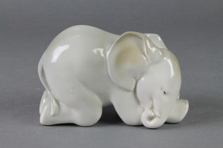 A 1970's Russian porcelain figure of a crouching elephant 6" 