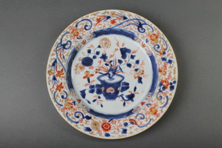 An 18th Century Imari plate decorated with a vase of flowers 9" 