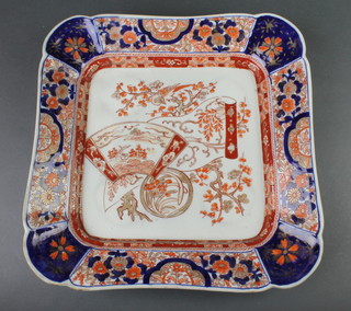 A late 19th Century Imari square dish decorated with birds amongst trees within a floral formal border 13" 