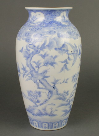 A Japanese blue and white vase decorated with birds amongst trees 12 1/2" 