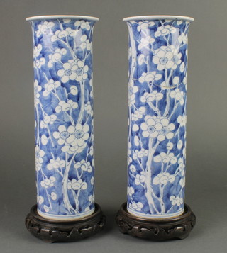 A pair of early 20th Century Chinese prunus cylindrical vases with flared necks 12" with 4 character mark to base 