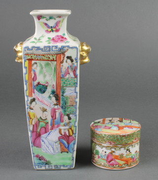 A late 19th Century Famille Rose square vase with lion handles, decorated with figures in pavilions alternated with butterflies and insects amongst flowers 8 1/2" together with a famille rose circular box and cover decorated with figures in pavilions and panels of butterflies and flowers 3 3/4" 