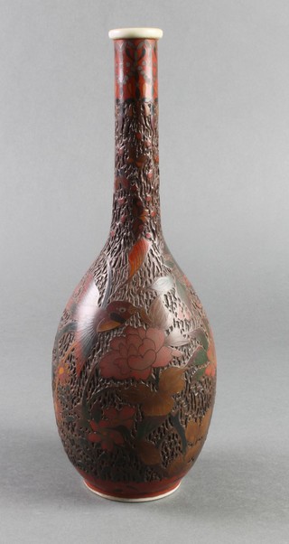 An early 20th Century Japanese porcelain bottle vase, the brown glazed body incised with birds amongst flowers 12" 