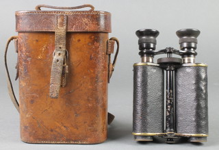 Ross of London, a pair of prism binoculars marked X12 no.13874 contained in a leather carrying case 