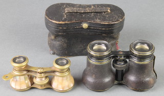 A pair of mother of pearl and gilt metal mounted opera glasses, 1 other pair of leather bound opera glasses (case slightly damaged) 