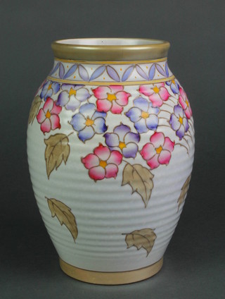 A Charlotte Rhead polychrome baluster ribbed vase decorated with flowers and Autumn leaves, 672, 8"h 