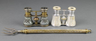 A pair of chrome and mother of pearl mounted opera glasses, a gilt metal pair of opera glasses and a brass telescopic toasting fork 