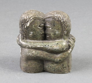 A carved Inuit hardstone statue of a figures embracing 2" 
