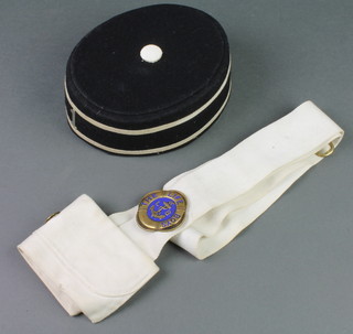A Boys Brigade pill box hat Mk1, a fabric cross belt and a life boys badge 