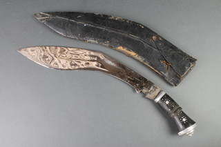 A Kukri with 14" blade and leather scabbard, there is a split to the leather scabbard 