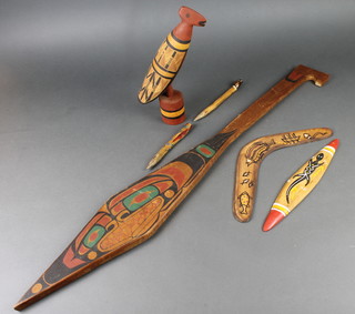 An Australian painted wooden paddle 36", a boomerang, a carved figure of a  bird 12" and 3 other items