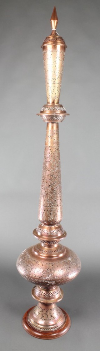 A "Moroccan" pierced copper standard lamp of tapering bulbous form 59"