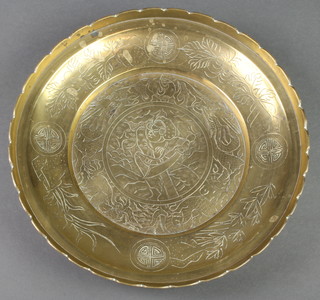 A 19th Century engraved Japanese brass bowl decorated a figure of a warrior, raised on 3 supports 11" 