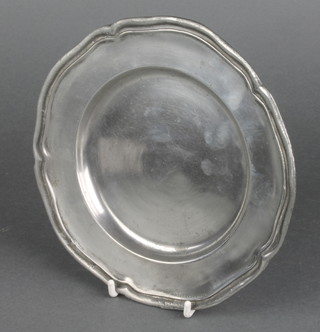 A pewter plate with bracketed border 7 1/2" 