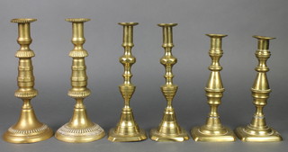 4 pairs of 19th Century brass candlesticks with ejectors