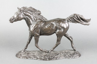 A bronzed figure of a running stallion raised on an oval naturalistic base 10" 