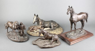 After Susan MacLaurin, limited edition bronzed figure "The Arab Stallion", raised on a rectangular wooden base 11", after Anne Godfrey a bronzed figure of an Arab horse being led by a nomad 7",  after P F Alexander a bronze figure of a seated foal 4 1/2" and a pottery figure group of a mare and foal 