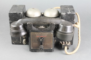 A Telephone Manufacturing Company field telephone, telephone set F Mk 1 no.57007 dated 1940 and with crows foot mark