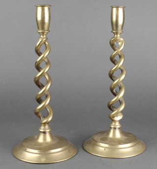 A pair of brass spiral candlesticks on circular bases 12" 
