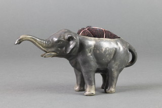 An Edwardian antimony pin cushion in the form of a walking elephant 6" 