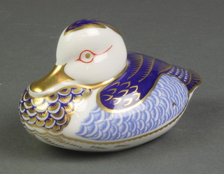 A Royal Crown Derby paperweight in the form of a seated duck 4 1/2", boxed 
