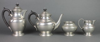 A Liberty's English pewter 4 piece planished tea service 
