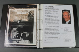 An album containing a collection of various black and white stills film photographs including and signed by Joey Bishop, Mel Gibson, Senta Berger, Clint Eastwood, Robert De Niro, Stacey Keach, Patrick Swayze, Jay Leon, Elizabeth Taylor, Bob Hope, Charles Bronson, Richard Benjamin, Allen King and many others 